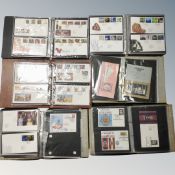A box of six albums of First Day covers, bag of loose stamps,
