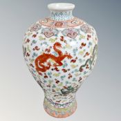 A 20th century Chinese bulbous porcelain vase decorated with dragons,