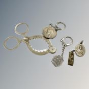 A coin pendant key ring, religious pendant,
