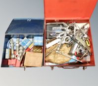 Two metal tool boxes containing milling and cutting tools, wrenches,