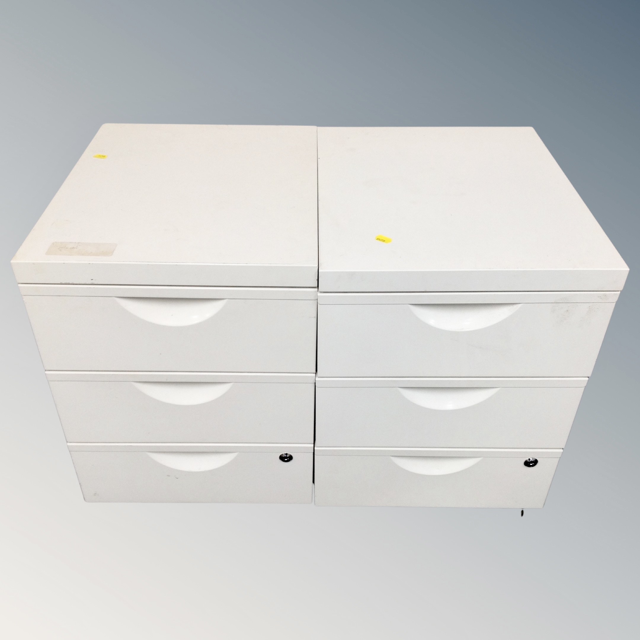 Two three drawer filing chests with wheels