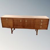 A 20th century Stonehill Stateroom teak triple door long sideboard CONDITION REPORT: