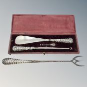 A Victorian cased silver mounted shoehorn and button hooks,