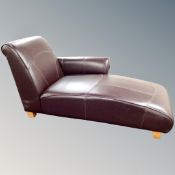 A contemporary chaise longue in Burgundy leather