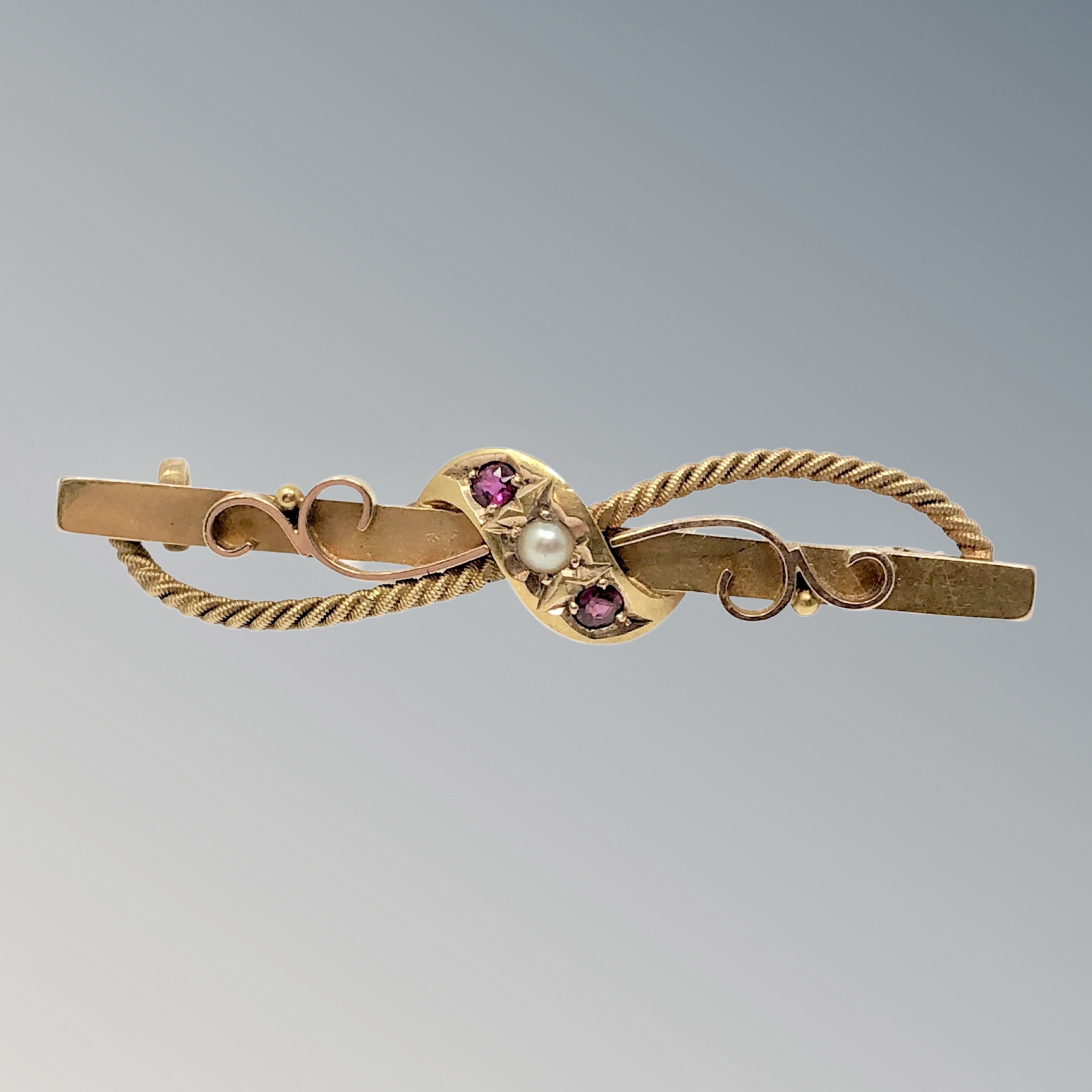 A 15ct gold ruby and pearl bar brooch CONDITION REPORT: 3.