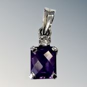An 18ct white gold amethyst and diamond pendant