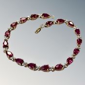 A gold simulated ruby bracelet CONDITION REPORT: 7.