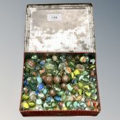 An old tin of marbles (Q)