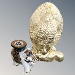 A gilt Buddha bust together with a ceramic elephant plant stand