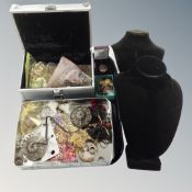 A metal box and tin containing costume jewellery, bronze eastern cymbals,