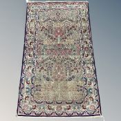 An antique Kirman rug, South East Iran, circa 1920, of Tree of Life design,
