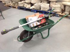 A wheel barrow containing performance angle grinder, boxed,