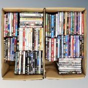 Two boxes containing approximately 100 dvds