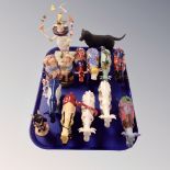 A tray of ten Cow Parade figures together with a Royal Doulton school master bunnykinsfigure,