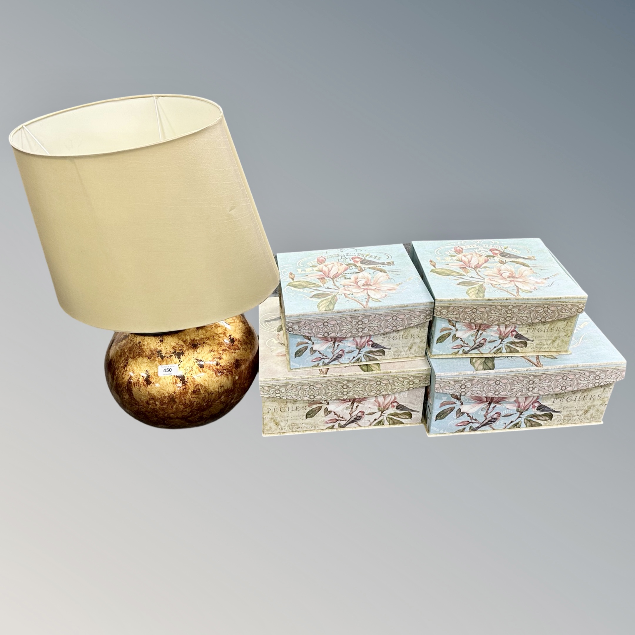 A contemporary copper finished table lamp with shade together with a set of four graduated French