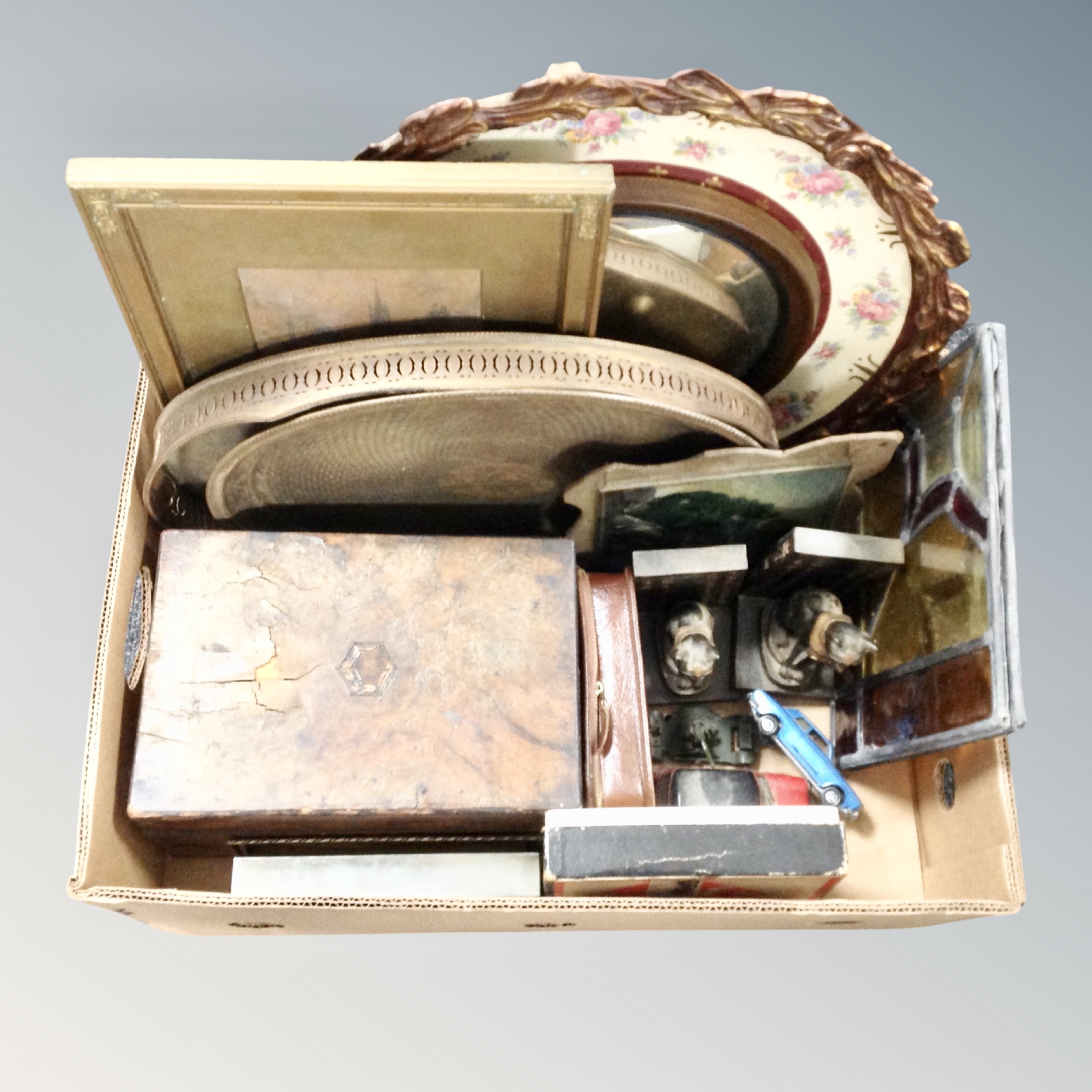 A box of antique and later leaded glass panels, plated trays, Victorian jewellery box, bookends,