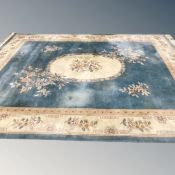 A large Chinese carpet on blue turquoise ground 402 cm x 302 cm CONDITION REPORT: