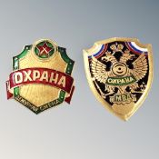 A group of two Law Enforcement breast shield-badges,