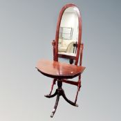 A Victorian style shaped pedestal hall table together with a cheval mirror