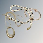 A torsion bangle together with multi-colour necklace, pendant necklace.