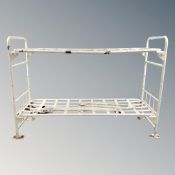 A set of metal prison bunk beds