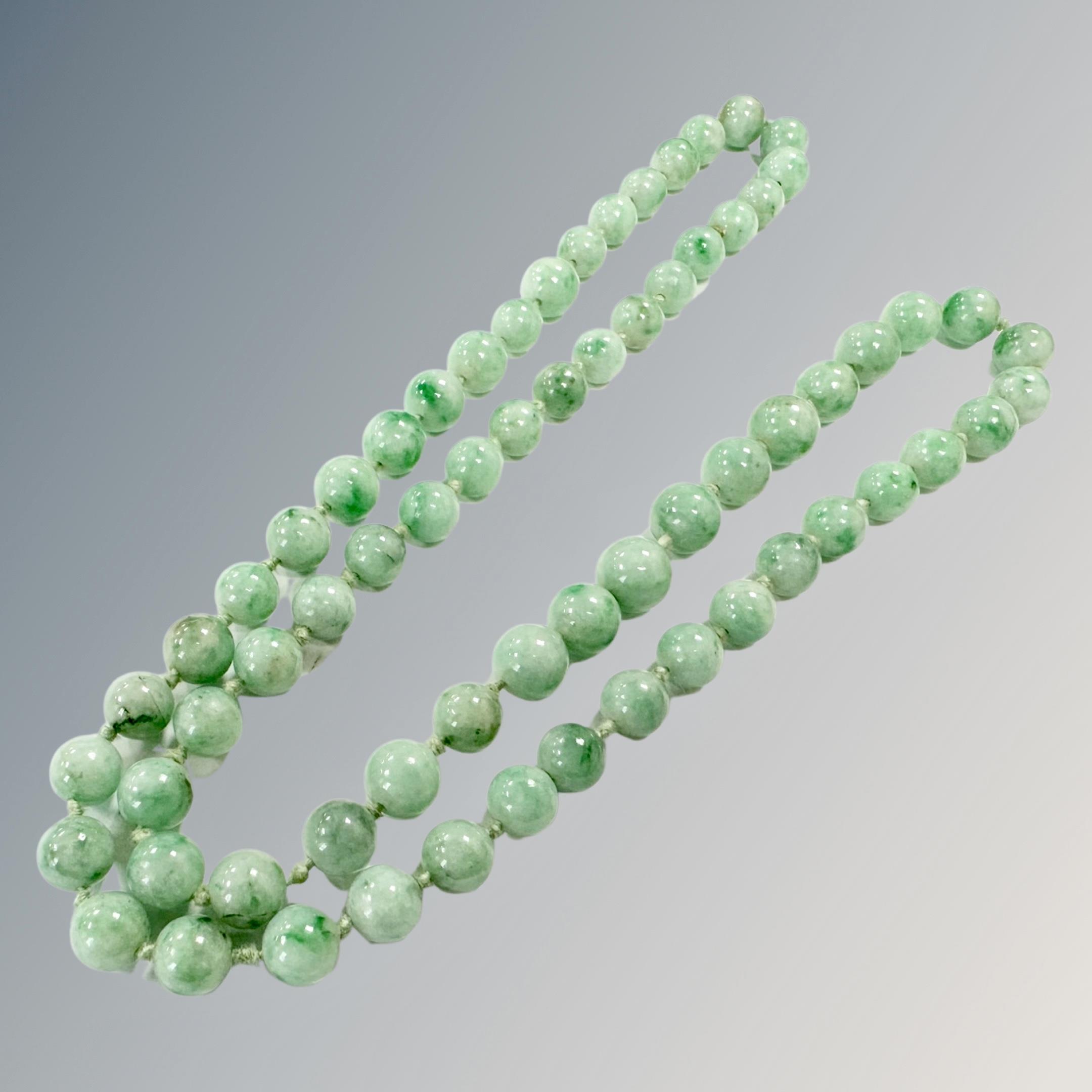 A long jade bead necklace, length 60cm.