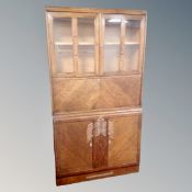 An Edwardian oak secretaire bookcase with cupboard beneath