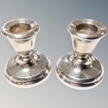 A pair of loaded silver squat candlesticks, height 5.
