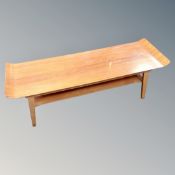 A 20th century bent plywood coffee table with undershelf