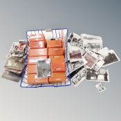 A wire metal tray containing 35mm slides,