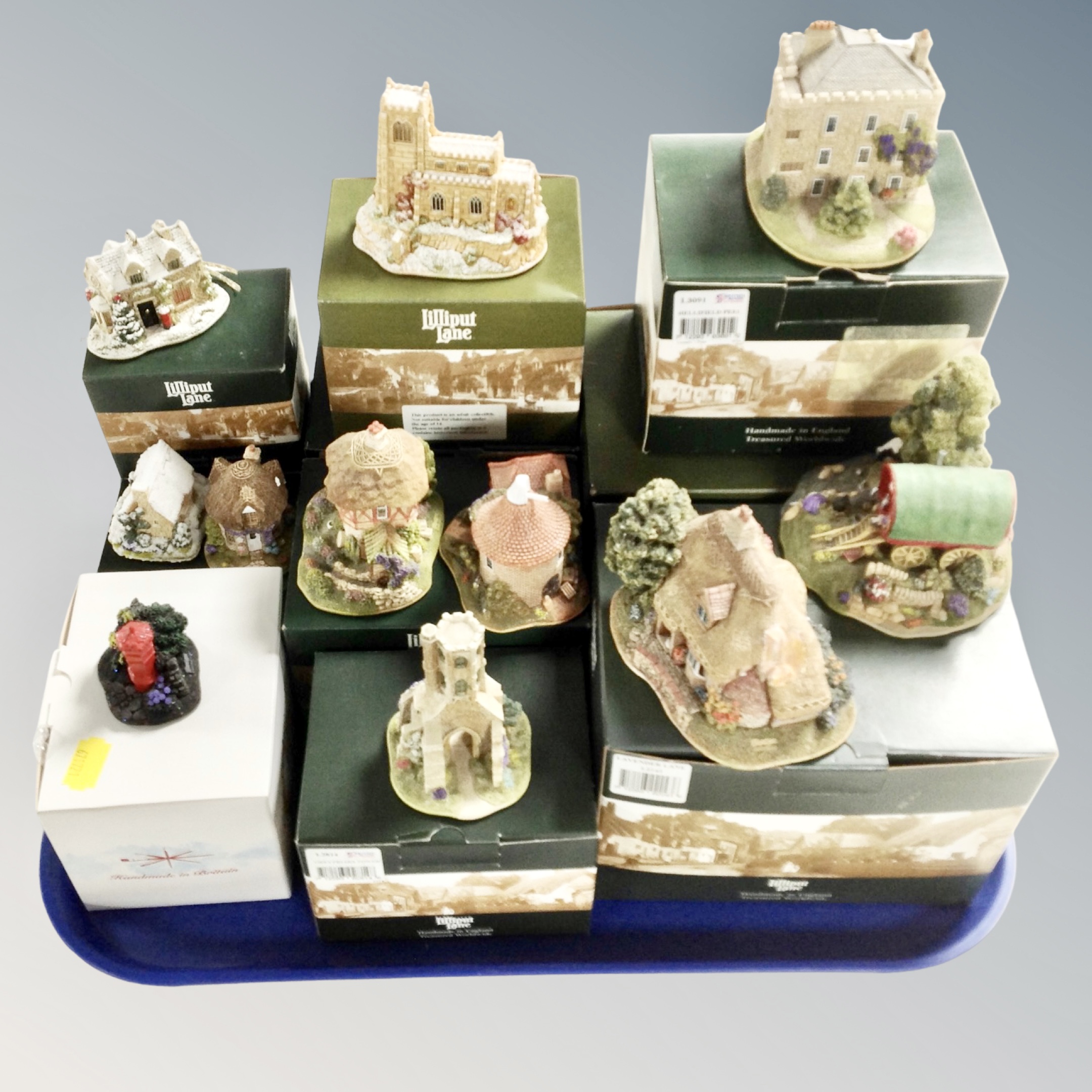 A tray of eleven Lilliput Lane ornaments, boxed.
