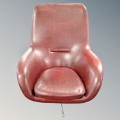 A 20th century armchair on chrome swivel base in Burgundy vinyl