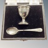 A silver egg cup and spoon in fitted box, Birmingham 1924.
