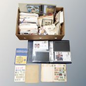 A box of 20th century stamp albums, world stamps, postcards, first day covers, loose stamps,