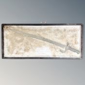 A French 1886 Chassepot bayonet, recovered from a WWI battlefield in 1993, framed.