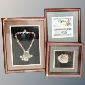 A rose crystal sample in display frame together with a Yemeni necklace in frame and Iraqi 25 dinars