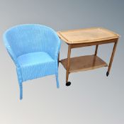A 20th century painted blue basket chair together with a 1970's trolley with lift off tray