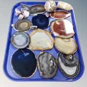 A tray of assorted rock samples, quartz ball,