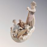 A Lladro figure - Girl pulling cart 1245