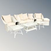 A good quality seven piece rattan conservatory suite with cushions - settee, pair of armchairs,