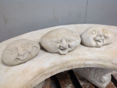 Three concrete 'happy face' figures