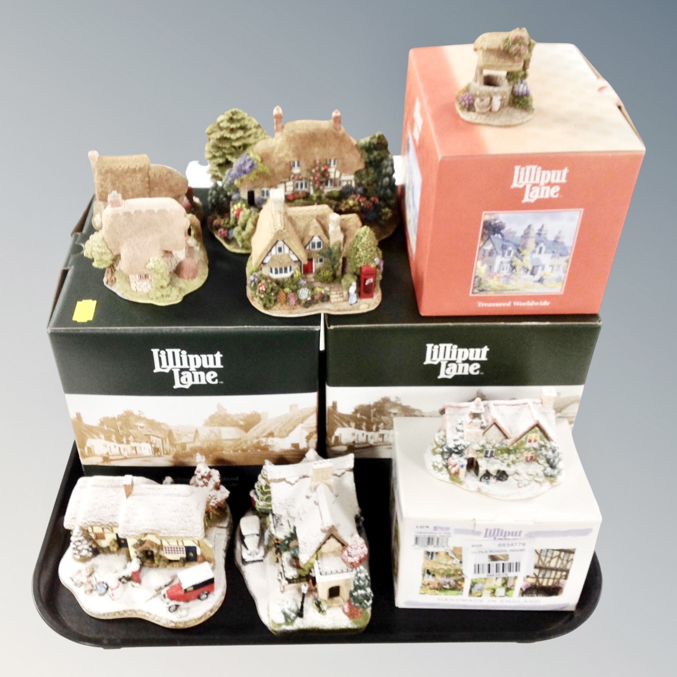 A tray of eight Lilliput Lane ornaments, four boxed.