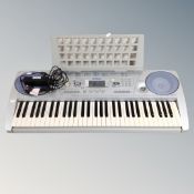 A Yamaha bass boost system PSR-275 electric keyboard
