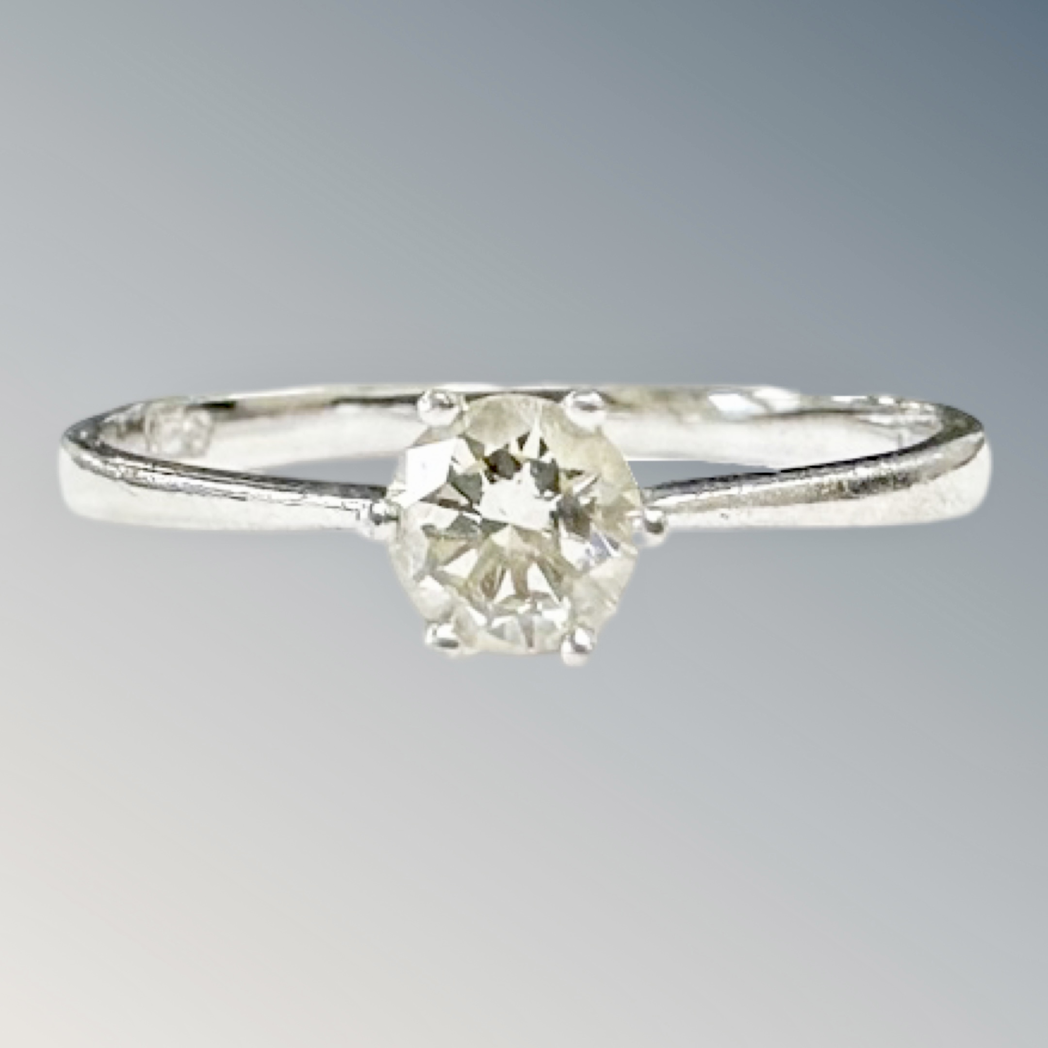 A platinum diamond solitaire ring, the stated diamond weight 0.