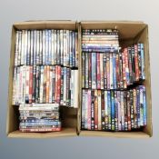 Two boxes containing approximately 100 dvds
