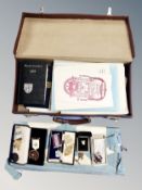 A leather Masonic case containing books,