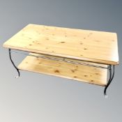 A Ducal pine two tier coffee table on metal legs