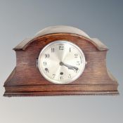 An Edwardian oak cased LGG striking mantel clock with silvered dial