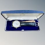 A gent's 9ct gold Garrard automatic calendar wristwatch, case 32mm.