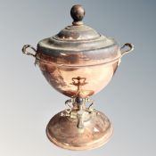 A 19th century copper and brass tea urn